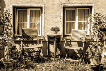 Fototapeta na wymiar old chairs at a backyard