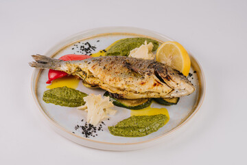 Whole dorado with lime with baked spinach and Tedemois cheese
