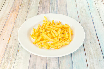 Tapa of typical preparation of the bars of Spain that consists of potatoes cut into large cubes, fried in olive oil and seasoned with salsa brava, which is a spicy sauce