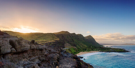 Panorama of Oahu south shore, including Makapuu Beach near Sea Life Park, from lookout during sunset