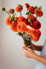 photo of a bouquet created from wild fresh spring flowers photographed on a white background in daylight, a metal bucket with flowers