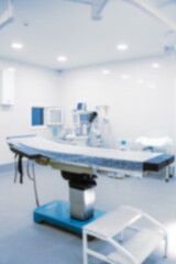Abstract blur of hospital and clinic interior. Modern equipment in operating room. Medical devices for neurosurgery. Surgery instruments and surgical procedures. Background with blue filter.