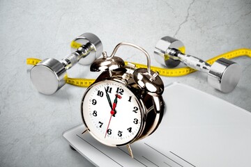 alarm clock with workout planing for dieting. Sport exercise equipment for fitness.