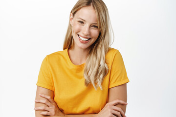 Portrit of beautiful modern woman with natural blond hair, white smile, clear perfect skin,...