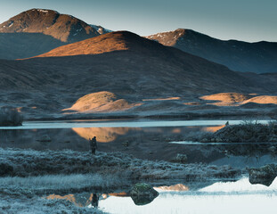 A lonely man looking at the mountains at dawn. © Jaroslaw