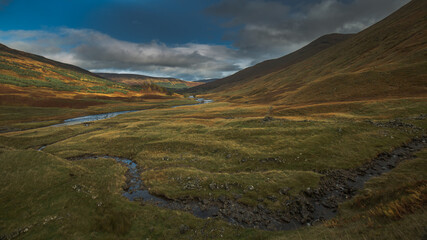 A winding stream in the valley of Glen Lyon Scotland.
