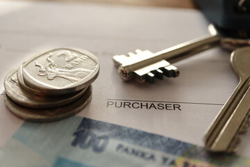 key to success. Home purchase. Home loan concept with keys and South African currency the Rand