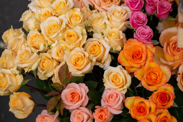 A flower bouquet with many colorful rose blooms