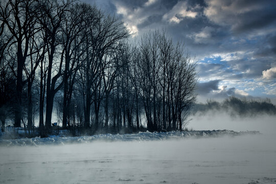 Ice mist rising from water on a cold winter day.