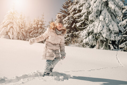 Child playing with snow
