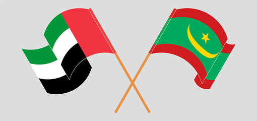Crossed and waving flags of the United Arab Emirates and Mauritania