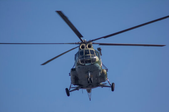 Military tranA military transport helicopter comes in for a landing, against the backdrop of a clear skysport helicopter comes in for landing, 
