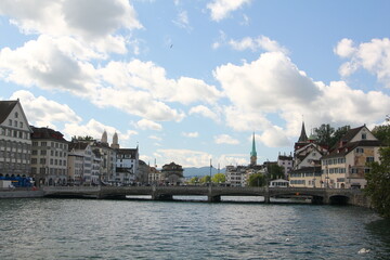 view of the historic city center of Zurich with Fraumunster Church on river Limmat