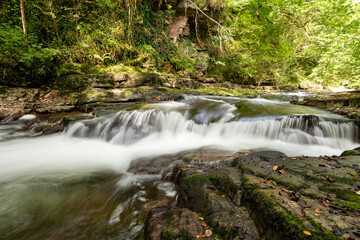 Long exposure of a waterfall on the East Lyn River at Watersmeet in Exmoor National Park