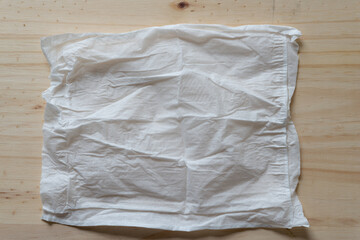 Obraz premium white tissue on a wooden surface