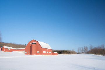 Old barn in a winter countryside landscape in Quebec, Canada