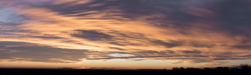 Beautiful bright crimson sunset over the village