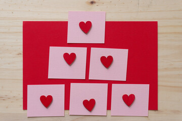 grungy wooden hearts on paper squares