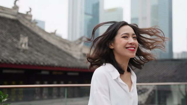 Happy asian woman travel in the city