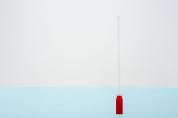 top view of test stick on blue and grey background, omicron variant concept.