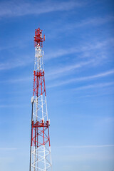 Telecommunication tower on the blue sky