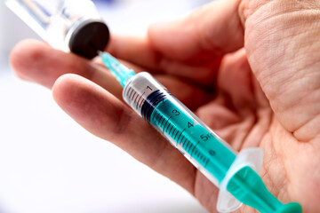  Vaccine in vial with syringe