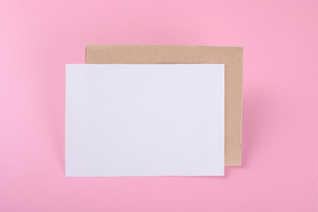 Blank wedding invitation stationery card mockup with envelope on pink background, feminine blog....