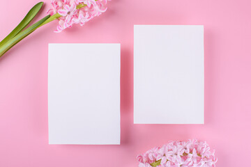 Two Blank wedding invitation stationery card mockup on pink background with hyacinth flowers, 5x7