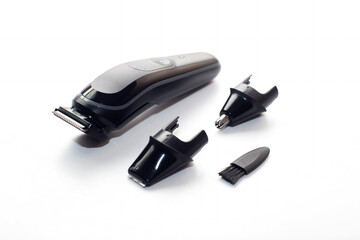 A set of the cordless electric hair clipper isolated on the white background