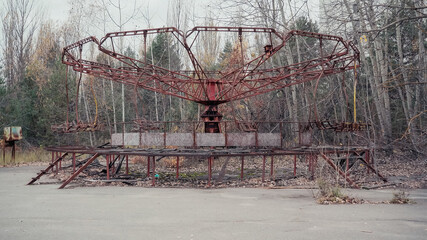 old carousel in amusement park in chernobyl abandoned city.