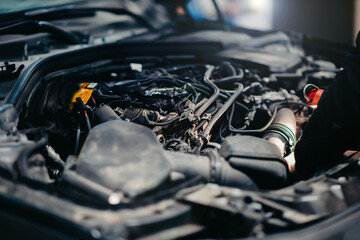 car repair concept, open hood in car service, wiring repair.