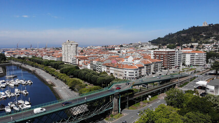 Obraz premium Aerial view of a bridge over the river Lima, linking the parish of Santa Maria Maggiore, in Viana do Castelo, Darque. Was opened in 1878, having been designed by the architect Gustave Eiffel.