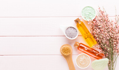 Beauty and aromatherapy concept with spa set on pastel rustic wooden background.