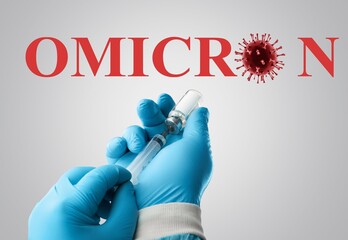 In this photo illustration of a new COVID-19 variant a medical syringe in a hand