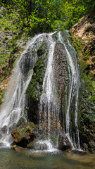 Obraz premium Waterfall in the mountains in nature.
