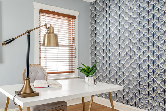 Vintage Home Office with Gold Desk Lamp and Bold Geometric Wallpaper