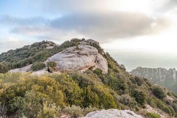 Picturesque landscape with mountains. Landscape and beautiful sunset on Montserrat mountain. Rock formations and cliffs in the Catalan Natural Park of Montserrat. Barcelona, Catalonia, Spain