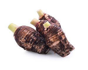 Taro root on old wooden background.