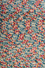Fototapeta na wymiar Variegated knitted wool pattern background