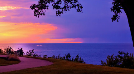 People taking a break on a bikeride, overlooking Lake Erie in Geneva-On-The-Lake, Ohio