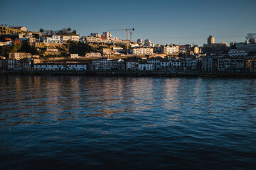 Fototapeta na wymiar View of the Douro River and Vila Nova de Gaia banks in the center of the Porto, Portugal.