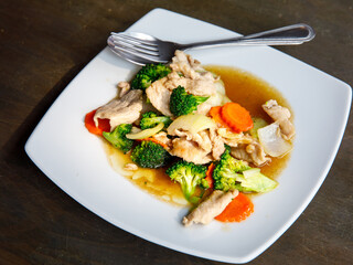 Broccoli stir fried with pork in oyster sauce, thai healthy food. Close up, selective focus