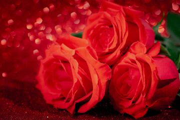 Bouquet of red roses on a shiny bokeh background. Valentine's day concept, place for text.