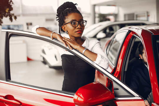 Stylish Black Woman In A Car Salon