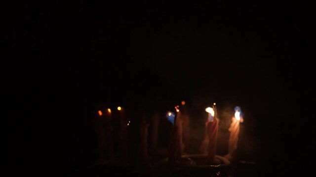 A child blows out the candles on the cake in your birthday. 10 years