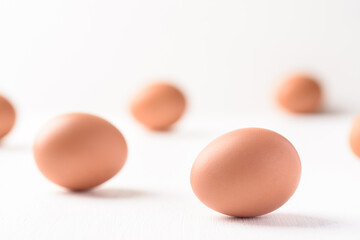 Fresh organic chicken eggs on white background.