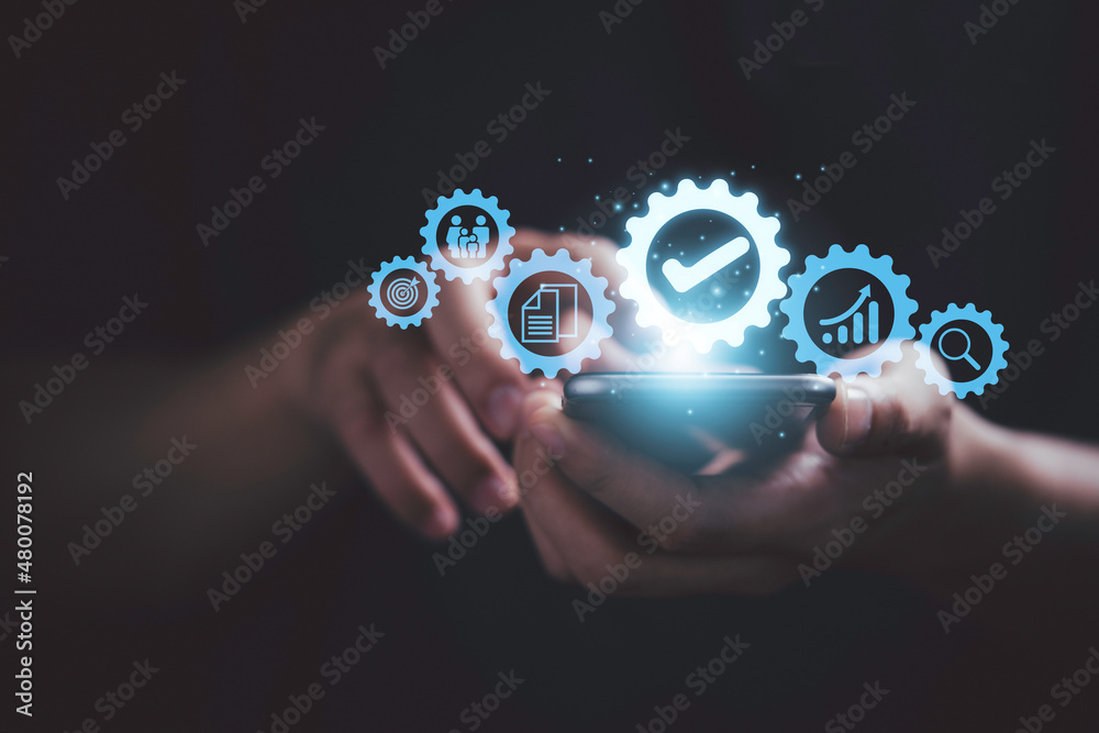 Poster Hand touching the best quality assurance with icons on mobile phone for guarantee product and ISO service concept.