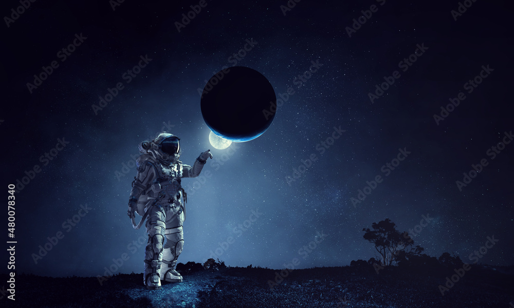 Wall mural astronaut walking on an unexplored planet