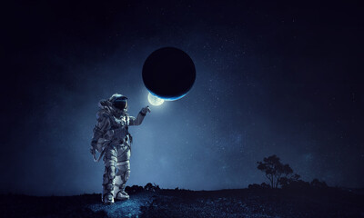 Astronaut walking on an unexplored planet