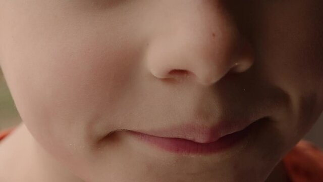 Close-up view of a little boy's smile.